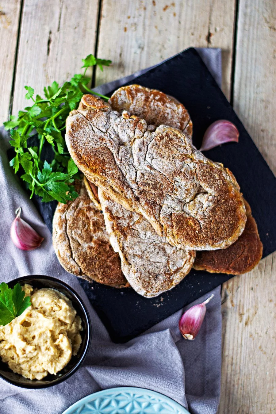 Closeup from the top on a stack of Easy Roasted Garlic Naan breads.