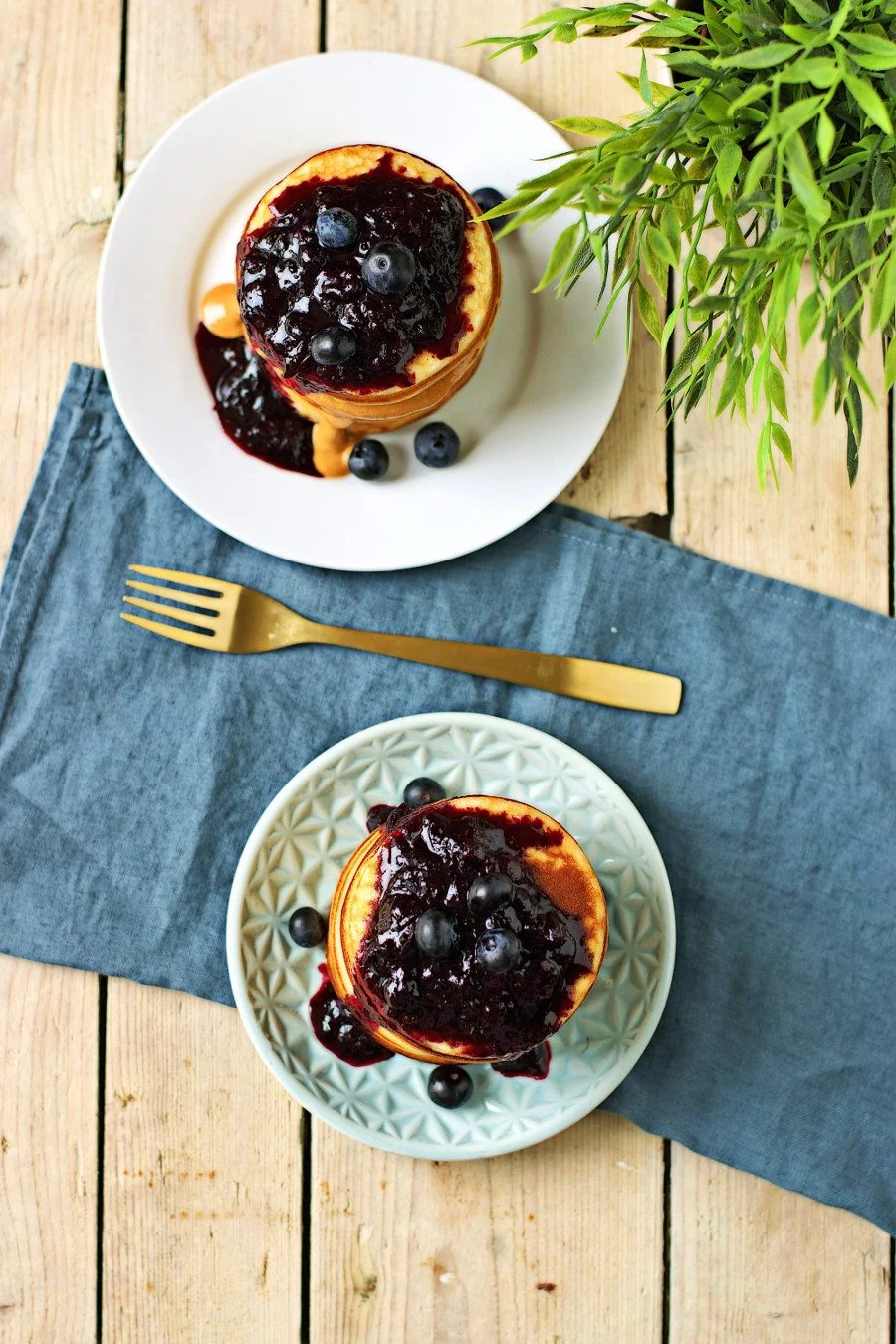 Top view on two plates with stacks of vegan pancakes