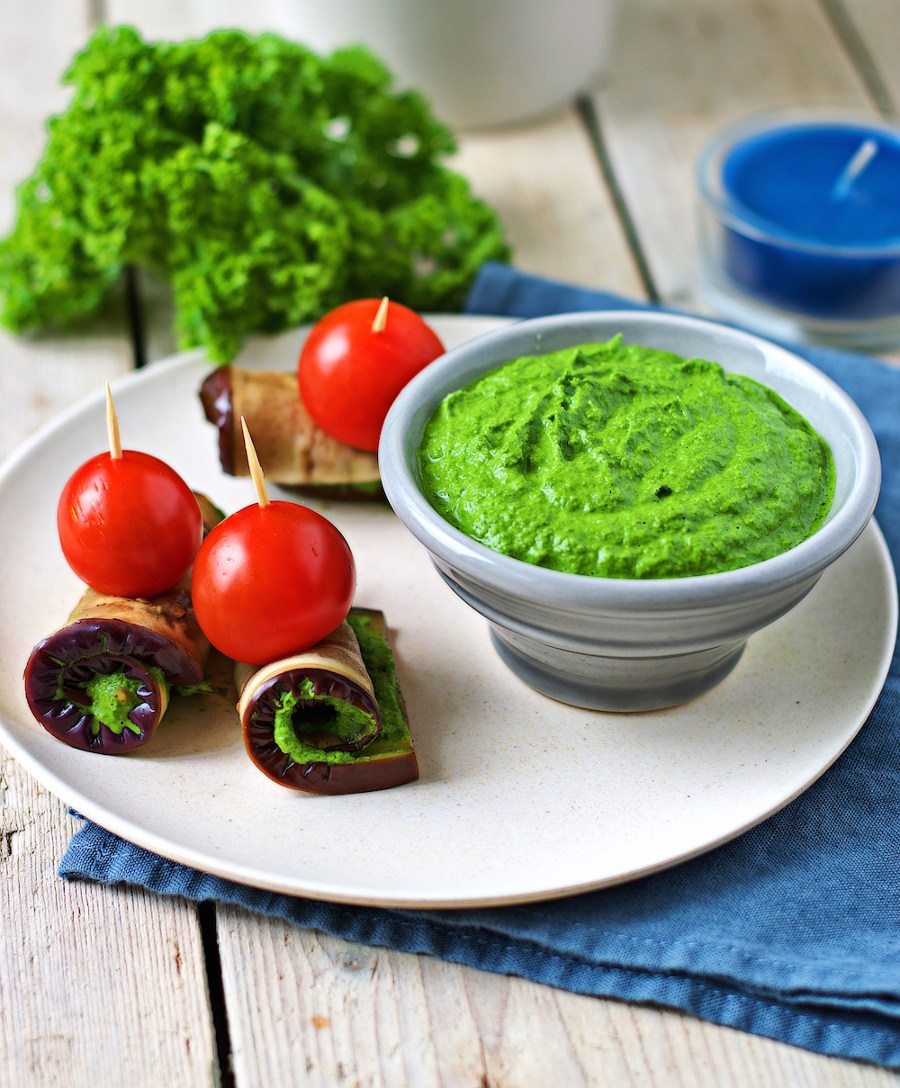 Kale Pesto and fresh vegetables on a plate.