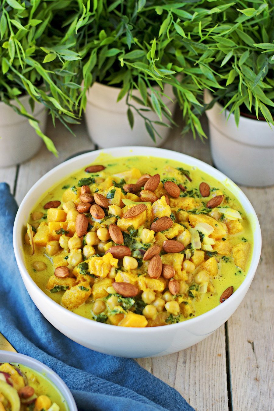 Large bowl of the Butternut Squash Soup topped with almonds.