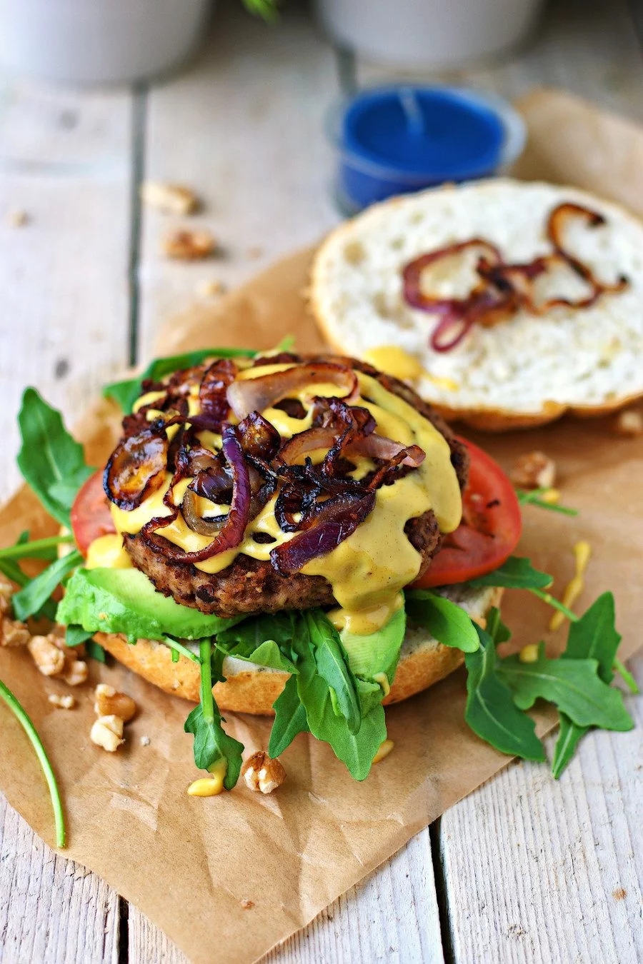 The Vegan Lentil Burger is topped with fried red onions.