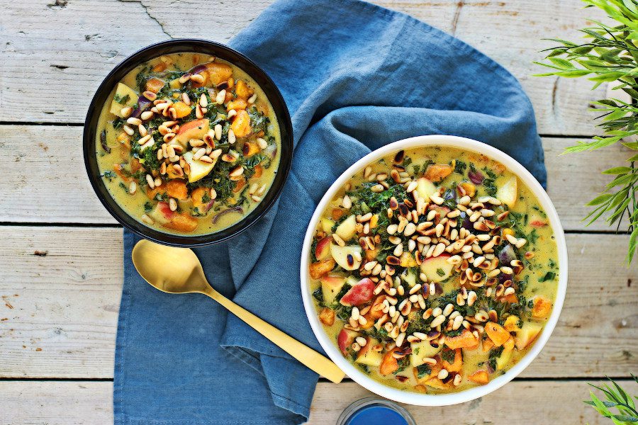 Top view on a small and large bowl of the Vegan Sweet Potato Soup with Kale