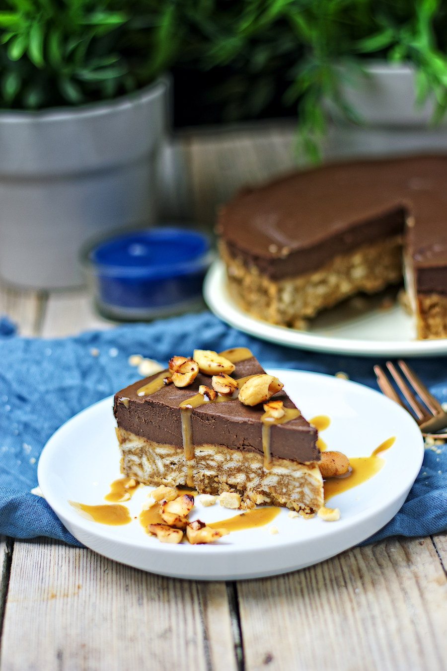 A slice of the Vegan Chocolate Cake showing the crunchy crust, topped with chocolate cream.