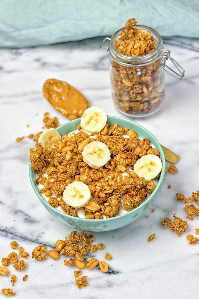 A bowl of yogurt topped with Homemade PB&J Granola.