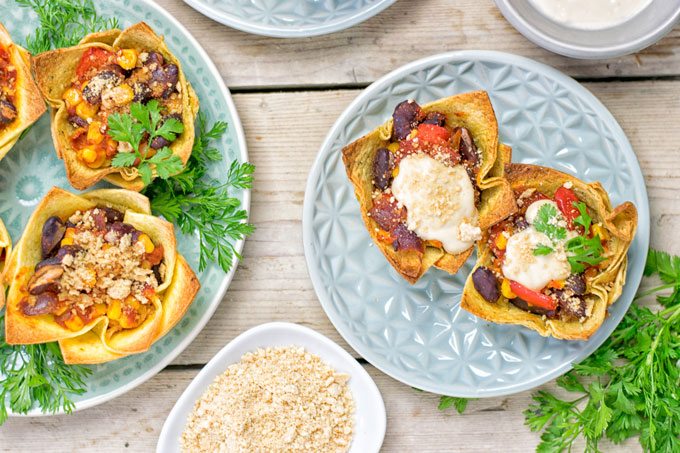 Top view on two plates wth Easy Vegan Taco Cups.