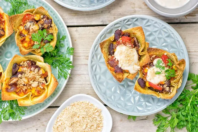 Top view on two plates wth Easy Vegan Taco Cups.