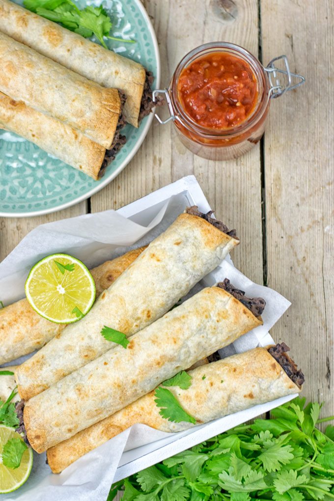 Top view on Vegan Cream Cheese Taquitos in a basket.