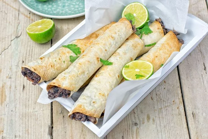 Side view on the Vegan Cream Cheese Taquitos showing the filling.