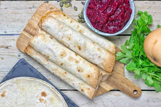 A stack of Pumpkin Vegan Cream Cheese Taquitos seen from above.