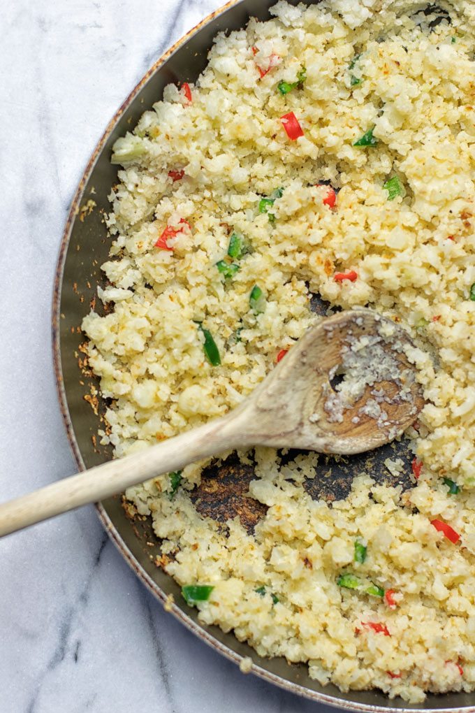 The Mexican Fiesta Cauliflower Rice being prepared in a pan.