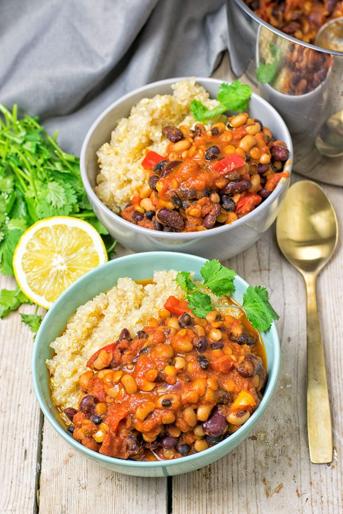 Two bowls of the Lentil Three Bean Chili served with quinoa.