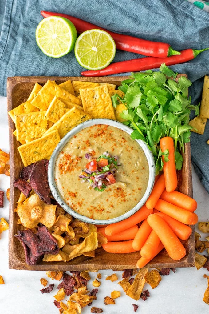 Top view on the Mexican Cheese Dip with snacks.