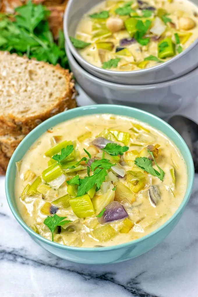 Closeup on a bowl of Vegan Cheese Leek Soup.