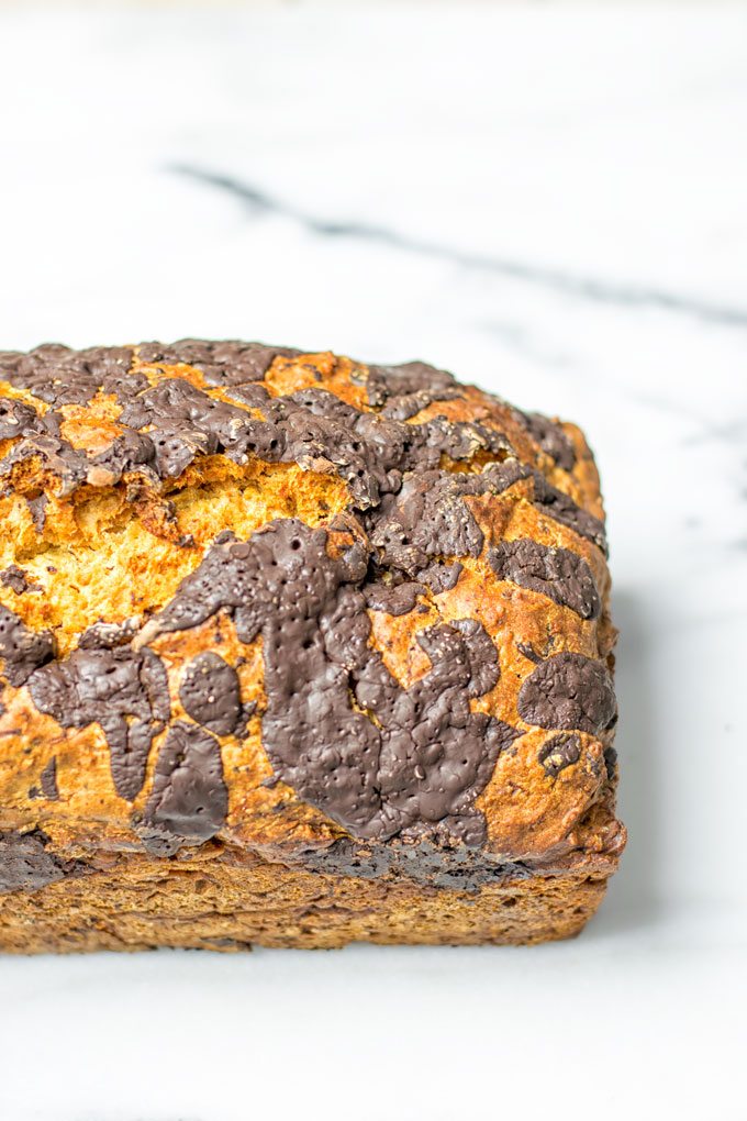 A full loaf of the Chocolate Chip Zucchini Bread from the side.