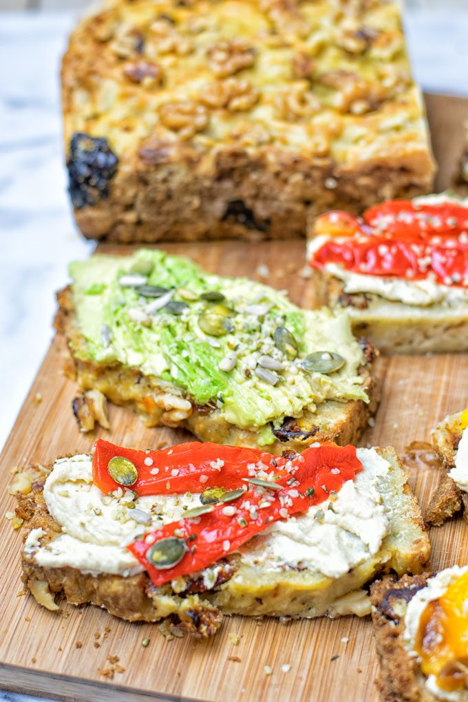 Several slices of the Sun Dried Tomato Garlic Bread with different toppings.