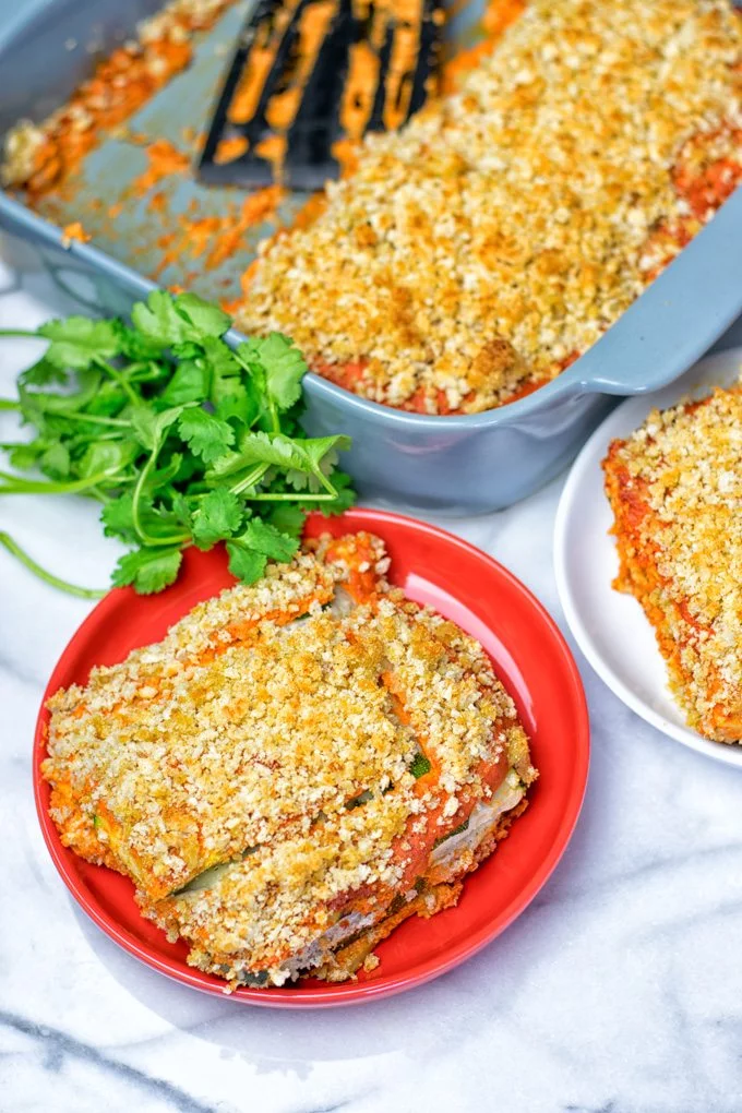 Portion of the Vegan Ricotta Zucchini Casserole on a small red plate.