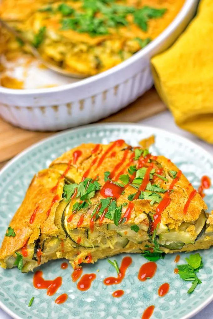 Hot sauce is drizzled over the Dairy-Free Zucchini Frittata.