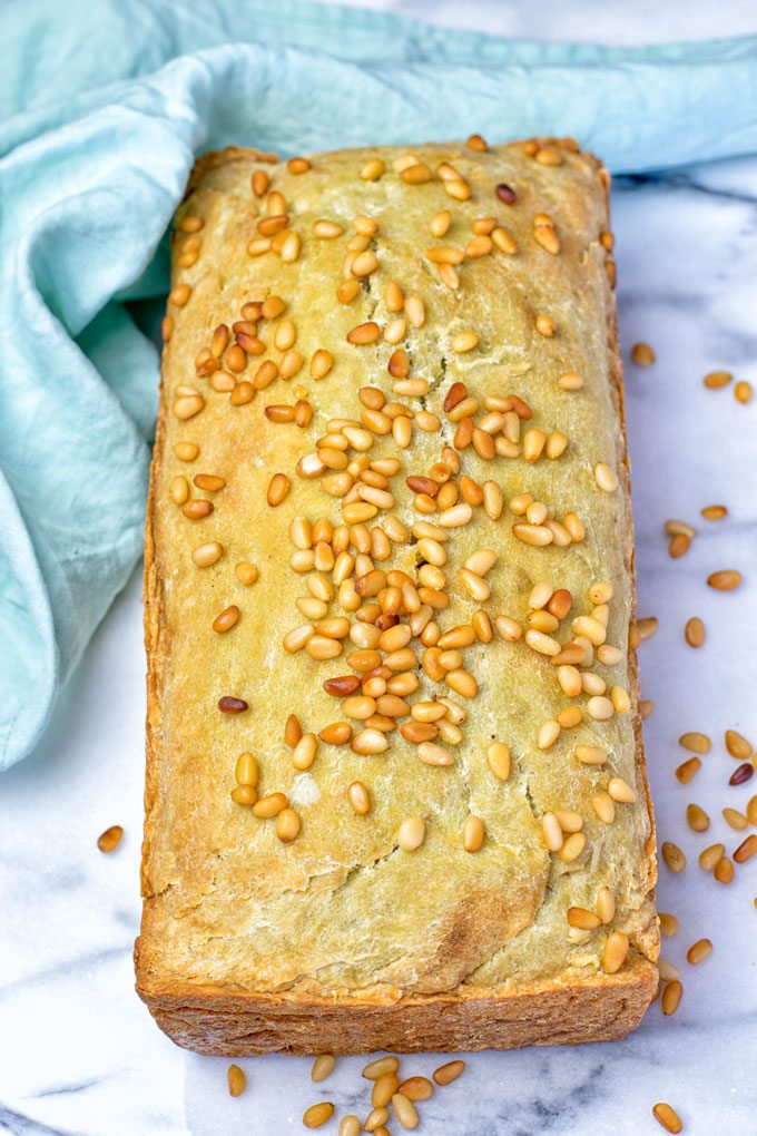 Top view of the Garlic Butter Avocado Bread with toasted pine nuts on top.