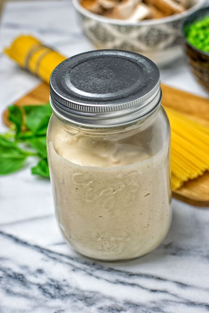 Spicy Tahini Pasta Sauce in a closed glass jar.