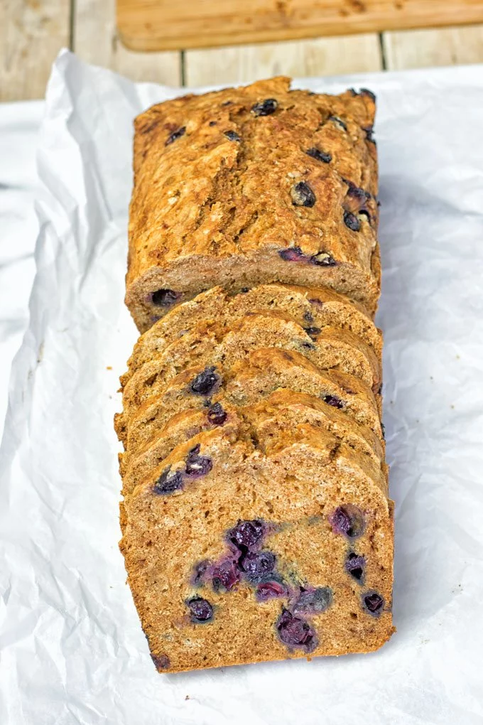 Gluten-Free Blueberry Bread slices on parchment paper.