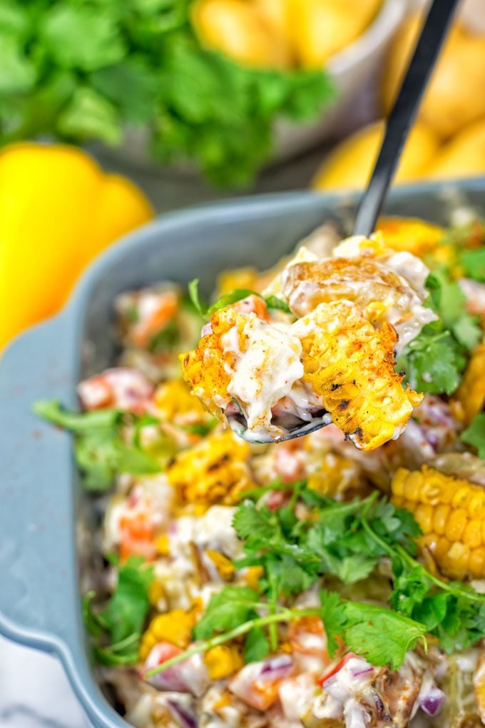 A spoon in the Mexican Street Corn Potato Salad.