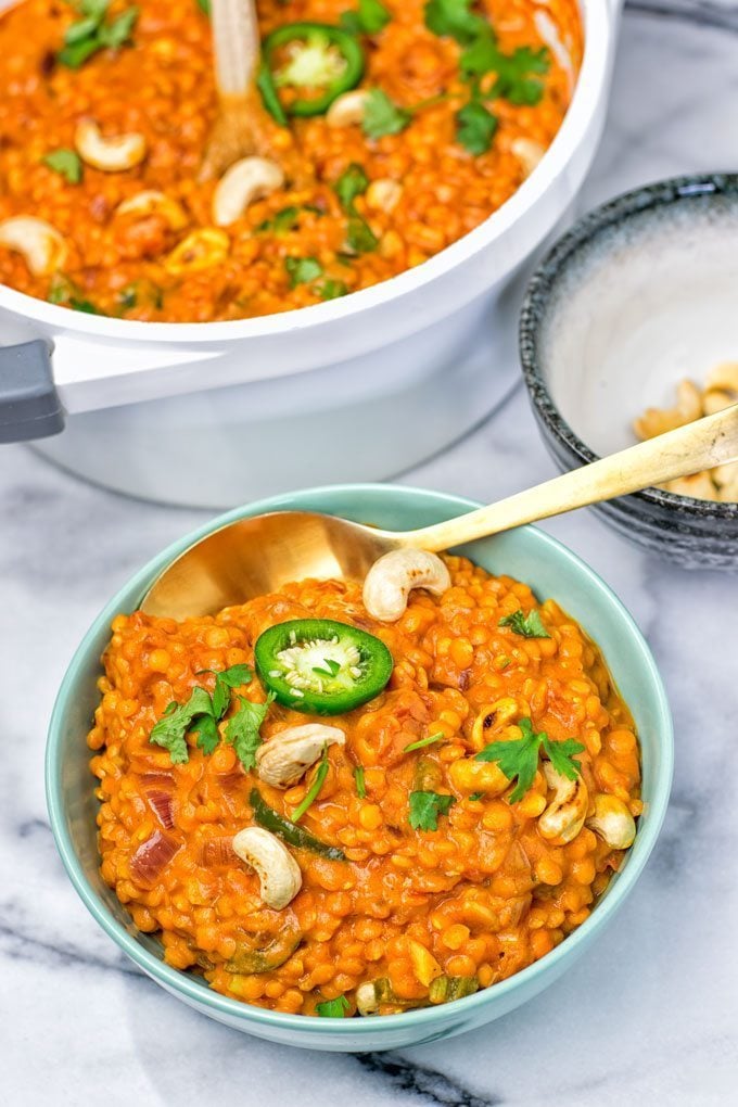 A golden spoon in a portion of the Red Lentil Dal. 