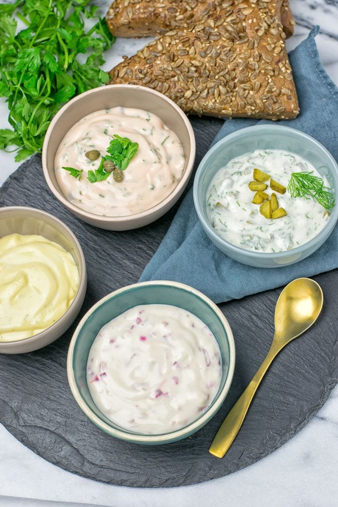 Four versions of the Vegan Tartar Sauce in small bowls.