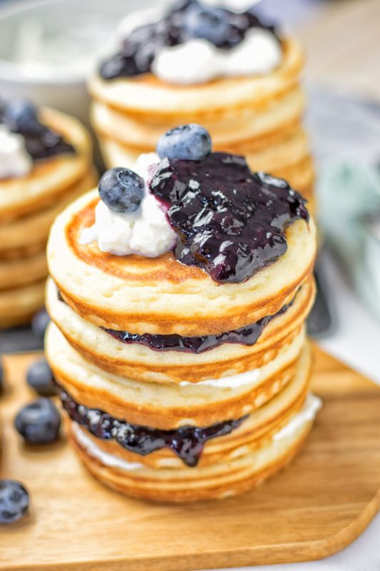 Stack of four Vegan Ricotta Blueberry Pancakes.