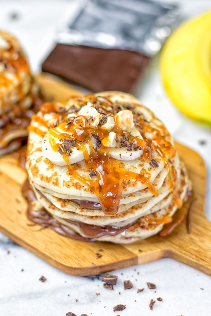 Extra caramel sauce is drizzled over Nutella Pancakes