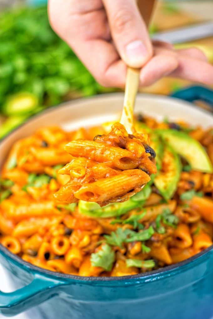 Lifting a creamy spoonful of the Vegetarian Fajita Pasta out of the pot.