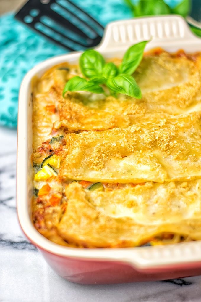 Creamy Carbonara Vegetarian Lasagna coming out of the oven.