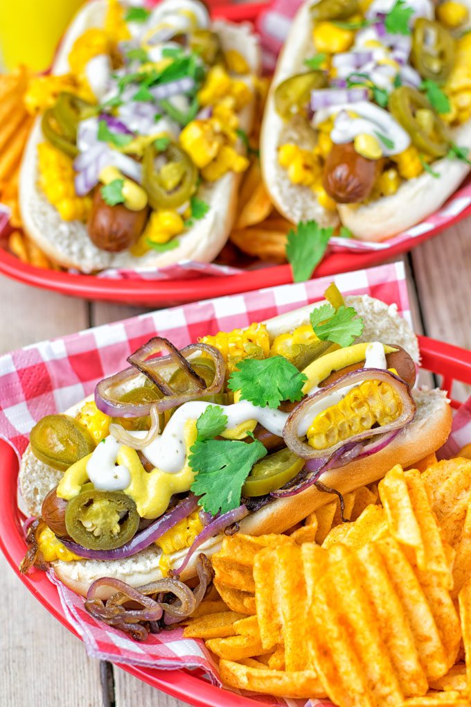 Mexican Street Corn Hot Dogs served in baskets.