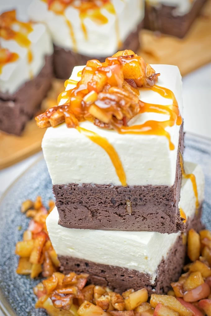 Cheesecake Brownies with Caramel Apples served for eating.
