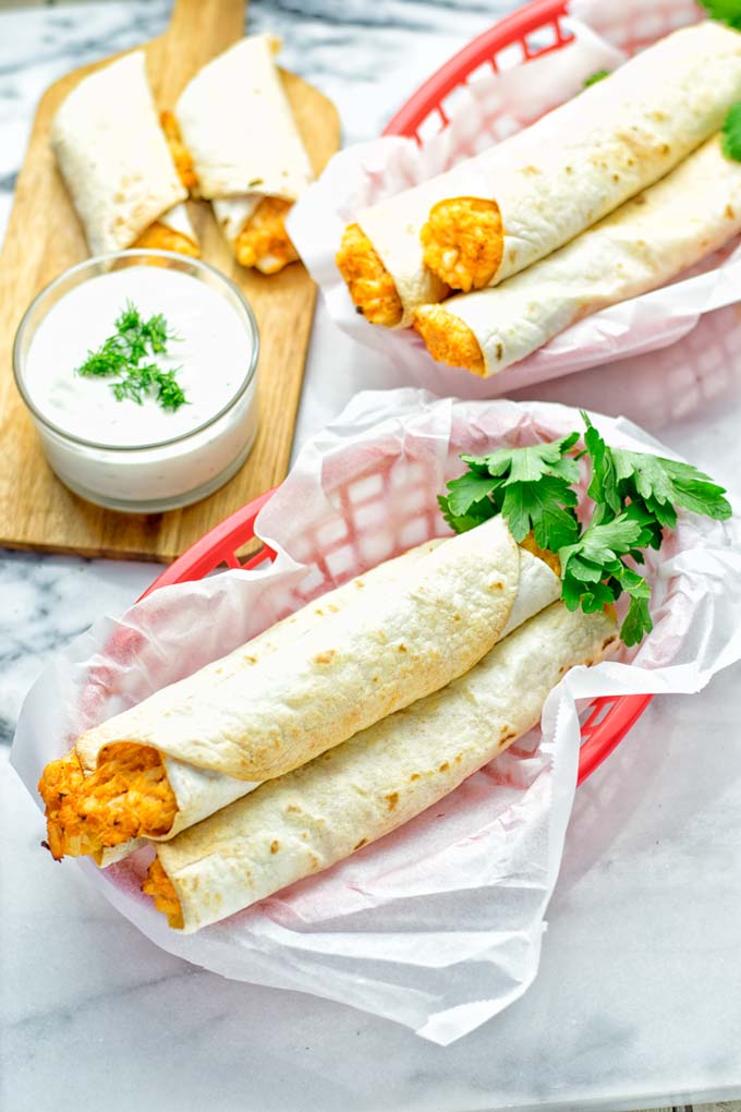 These Buffalo Cauliflower Taquitos are the ultimate comfort food. Vegan, gluten free, super easy to make and insanely delicious. An amazing dairy free alternative for dinner, lunch, potluck, party, meal prep, work lunch option. Once you’ll try these, they will go into your daily rotation. #vegan #glutenfree #vegetarian #dairyfree #plantbased #contentednesscooking #lunch #dinner #mealprep #worklunchideas #taquitos #buffalocauliflower #easyfood #budgetfriendly #makeahedmeals #cauliflower