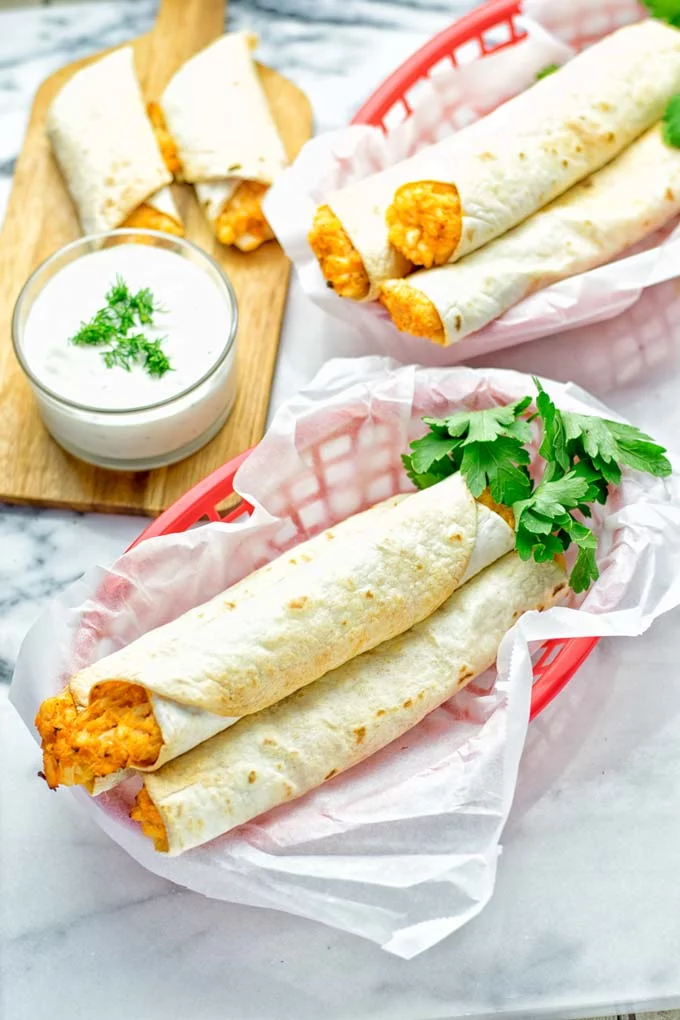 These Buffalo Cauliflower Taquitos are the ultimate comfort food. Vegan, gluten free, super easy to make and insanely delicious. An amazing dairy free alternative for dinner, lunch, potluck, party, meal prep, work lunch option. Once you’ll try these, they will go into your daily rotation. #vegan #glutenfree #vegetarian #dairyfree #plantbased #contentednesscooking #lunch #dinner #mealprep #worklunchideas #taquitos #buffalocauliflower #easyfood #budgetfriendly #makeahedmeals #cauliflower