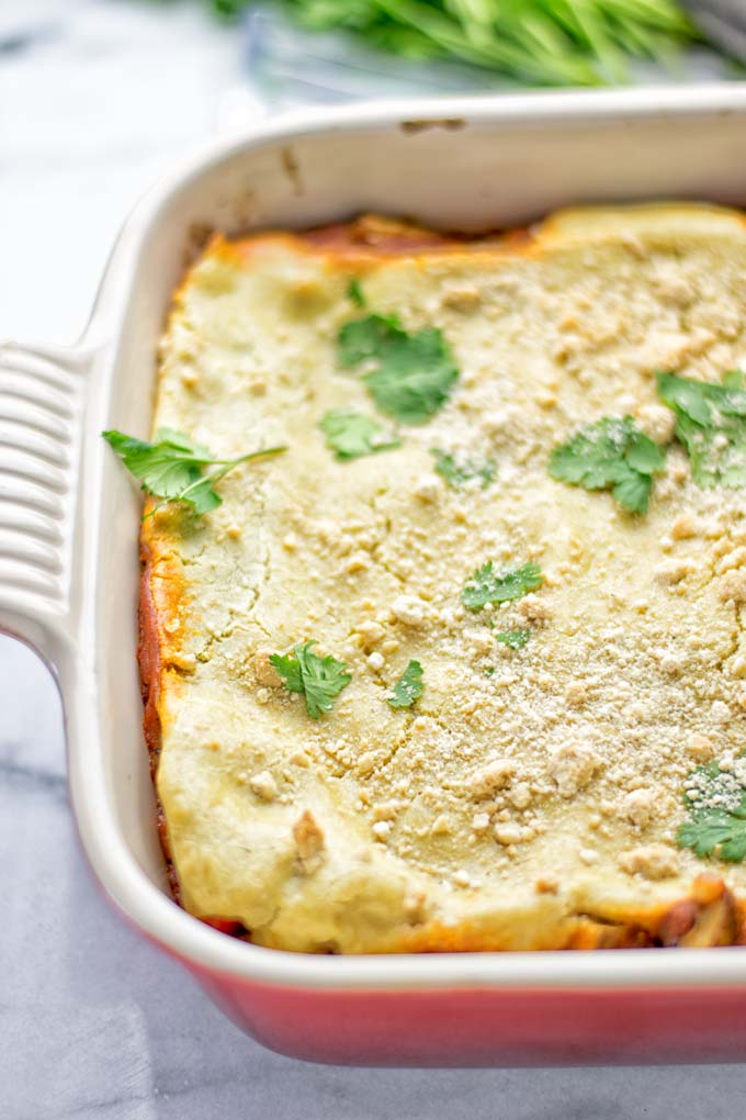 Super easy and delicious: This Enchilada Lasagna is naturally vegan, gluten free and a winning combination for any food lover. An amazing dairy free lunch, dinner, meal prep, work lunch and easy family dinner that will blow you away with just the right amount of flavor and spices. Come and try this fantastic dairy free alternative now, so good! #vegan #glutenfree #vegetarian #dairyfree #enchilada #lasagna #mealprep #worklunchideas #contentednesscooking #dinner #lunch #easyfamilyrecipes #easyfood