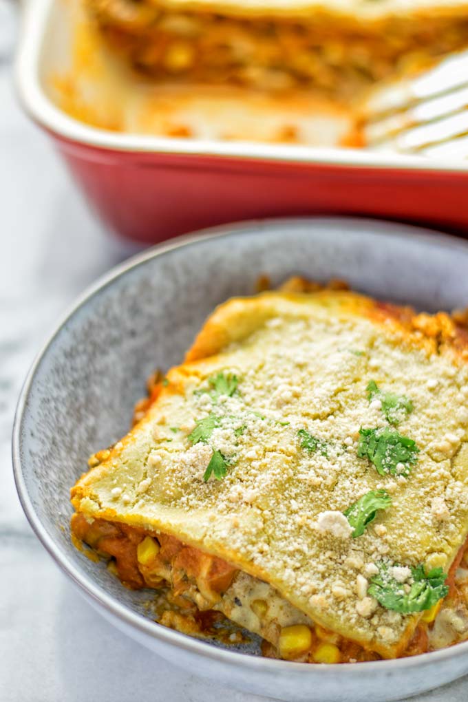 Super easy and delicious: This Enchilada Lasagna is naturally vegan, gluten free and a winning combination for any food lover. An amazing dairy free lunch, dinner, meal prep, work lunch and easy family dinner that will blow you away with just the right amount of flavor and spices. Come and try this fantastic dairy free alternative now, so good! #vegan #glutenfree #vegetarian #dairyfree #enchilada #lasagna #mealprep #worklunchideas #contentednesscooking #dinner #lunch #easyfamilyrecipes #easyfood