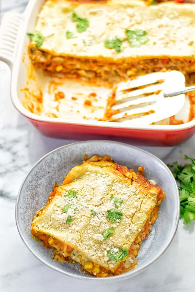 Super easy and delicious: This Enchilada Lasagna is naturally vegan, gluten free and a winning combination for any food lover. An amazing dairy free lunch, dinner, meal prep, work lunch and easy family dinner that will blow you away with just the right amount of flavor and spices. Come and try this fantastic dairy free alternative now, so good! #vegan #glutenfree #vegetarian #dairyfree #enchilada #lasagna #mealprep #worklunchideas #contentednesscooking #dinner #lunch #easyfamilyrecipes #easyfood