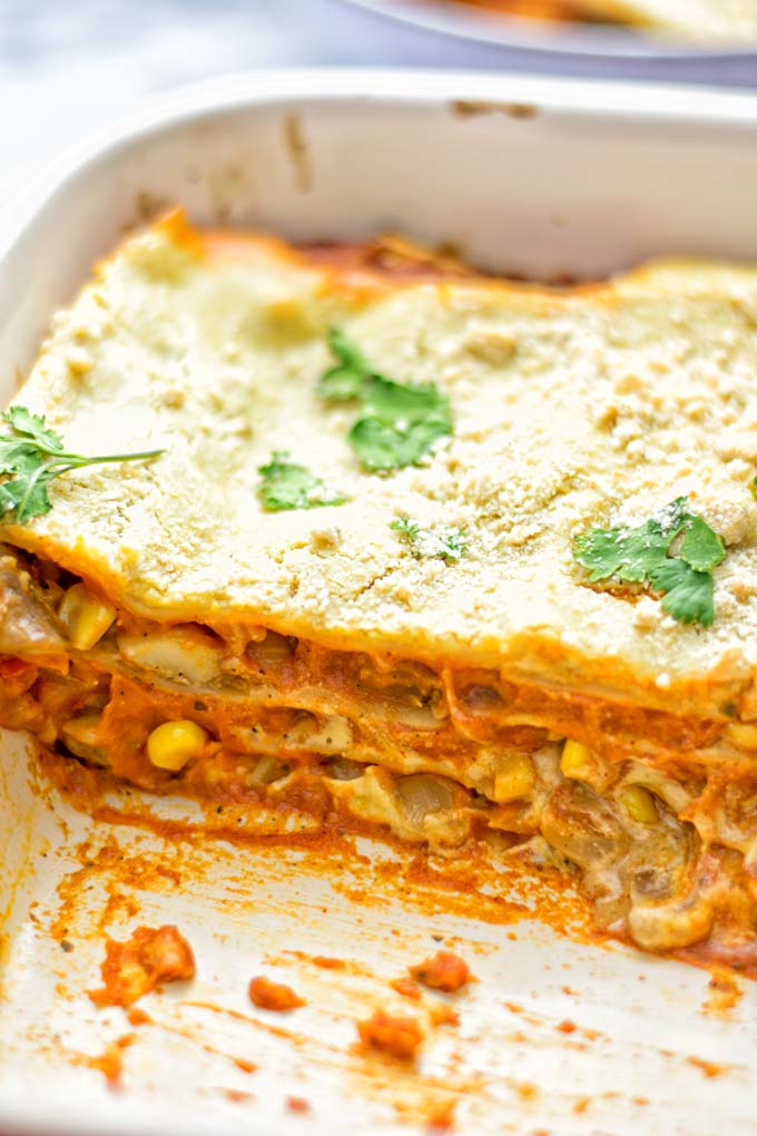 Super easy and delicious: This Enchilada Lasagna is naturally vegan, gluten free and a winning combination for any food lover. An amazing dairy free lunch, dinner, meal prep, work lunch and easy family dinner that will blow you away with just the right amount of flavor and spices. Come and try this fantastic dairy free alternative now, so good! #vegan #glutenfree #vegetarian #dairyfree #enchilada #lasagna #mealprep #worklunchideas #contentednesscooking #dinner #lunch #easyfamilyrecipes #easyfood