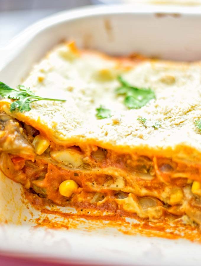 Super easy and fingerlicking delicious: This Enchilada Lasagna is naturally vegan gluten free and a winning combination for any good food lover. An amazing dairy free lunch, dinner, meal prep, work lunch and easy family dinner that will blow you away with just the right amount of flavors and spices. Come and try this fantastic dairy free alternative now, so good! #vegan #glutenfree #vegetarian #dairyfree #enchilada #lasagna #mealprep #worklunchideas #contentednesscooking #dinner #lunch #easyfamilyrecipes #easyfood