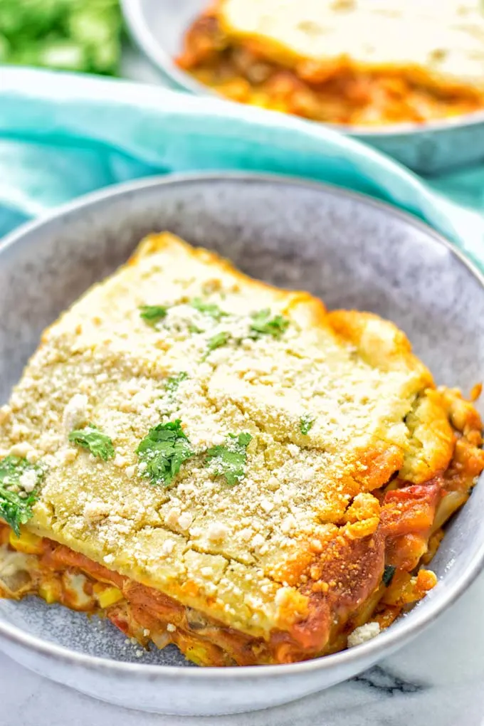 Super easy and delicious: This Enchilada Lasagna is naturally vegan, gluten free and a winning combination for any food lover. An amazing dairy free lunch, dinner, meal prep, work lunch and easy family dinner that will blow you away with just the right amount of flavor and spices. Come and try this fantastic dairy free alternative now, so good! #vegan #glutenfree #vegetarian #dairyfree #enchilada #lasagna #mealprep #worklunchideas #contentednesscooking #dinner #lunch #easyfamilyrecipes #easyfood