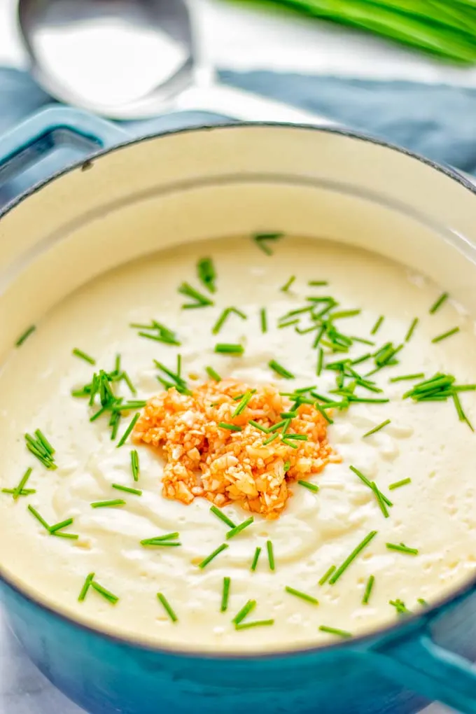 This Buffalo Cauliflower Soup is the ultimate comfort food for everyone and so satisfying. Vegan, gluten free, made without any cream or butter, an amazing and delicious option for dinner, lunch, meal prep, worklunch and so much more. This is a keeper try it now! #vegan #glutenfree #dairyfree #vegetarian #cauliflower #dinner #lunch #soup #mealprep #worklunchideas #easyfood #buffalocauliflower #contentednesscooking