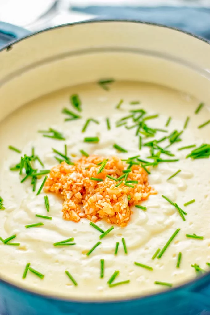 This Buffalo Cauliflower Soup is the ultimate comfort food for everyone and so satisfying. Vegan, gluten free, made without any cream or butter, an amazing and delicious option for dinner, lunch, meal prep, worklunch and so much more. This is a keeper try it now! #vegan #glutenfree #dairyfree #vegetarian #cauliflower #dinner #lunch #soup #mealprep #worklunchideas #easyfood #buffalocauliflower #contentednesscooking