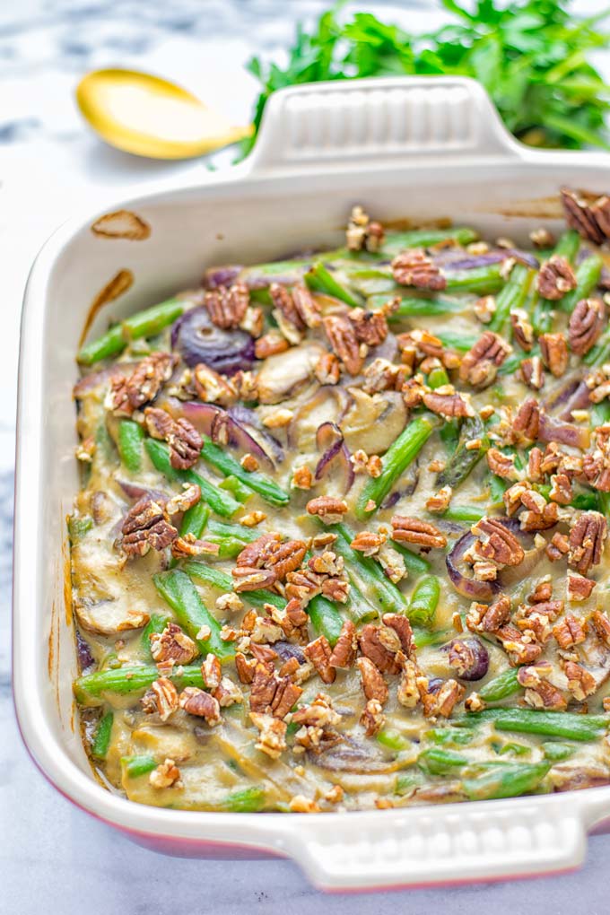 This Green Bean Casserole with Maple Pecans is insanely delicious and super easy to make with the best homemade cream of mushroom soup you can ask for. Entirely vegan, gluten free and so fantastic for dinner, lunch, meal prep, work lunch. An amazing dairy free alternative uses maple pecans instead of breadcrumbs. Perfect for holidays, Christmas. #vegan #glutenfree #dairyfree #vegetarian #dinner #lunch #mealprep #worklunchideas #contentednesscooking #holidaymeals #christmas #greenbeancasserole