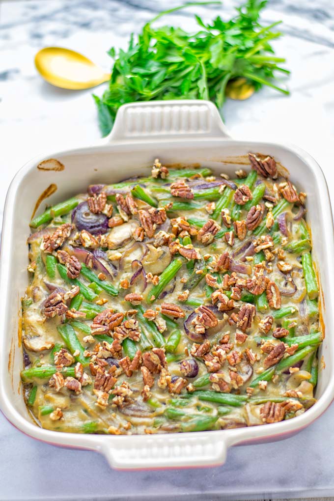 This Green Bean Casserole with Maple Pecans is insanely delicious and super easy to make with the best homemade cream of mushroom soup you can ask for. Entirely vegan, gluten free and so fantastic for dinner, lunch, meal prep, work lunch. An amazing dairy free alternative uses maple pecans instead of breadcrumbs. Perfect for holidays, Christmas. #vegan #glutenfree #dairyfree #vegetarian #dinner #lunch #mealprep #worklunchideas #contentednesscooking #holidaymeals #christmas #greenbeancasserole