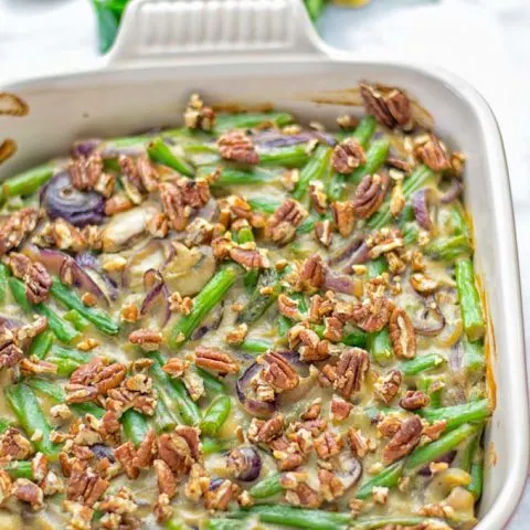 This Green Bean Casserole with Maple Pecans is insanely delicious and super easy to make with the best homemade cream of mushroom soup you can ask for. Entirely vegan, gluten free and so fantastic for dinner, lunch, meal prep, work lunch. An amazing dairy free alternative uses maple pecans instead of breadcrumbs. Perfect for holidays, Christmas. #vegan #glutenfree #dairyfree #vegetarian #dinner #lunch #mealprep #worklunchideas #contentednesscooking #holidaymeals #christmas #greenbeancasserole