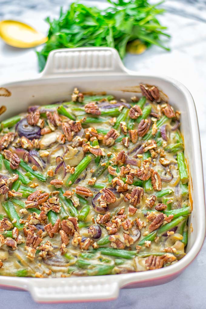 This Green Bean Casserole with Maple Pecans is insanely delicious and super easy to make with the best homemade cream of mushroom soup you can ask for. Entirely vegan, gluten free and so fantastic for dinner, lunch, meal prep, work lunch. An amazing dairy free alternative uses maple pecans instead of breadcrumbs. Perfect for holidays, Christmas. #vegan #glutenfree #dairyfree #vegetarian #dinner #lunch #mealprep #worklunchideas #contentednesscooking #holidaymeals #christmas #greenbeancasserole