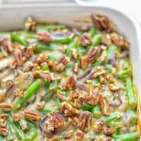 This Green Bean Casserole with Maple Pecans is insanely delicious and super easy to make with the best homemade cream of mushroom soup you can ask for. Entirely vegan, gluten free and so fantastic for dinner, lunch, meal prep, work lunch. An amazing dairy free alternative uses maple pecans instead of breadcrumbs. Perfect for holidays, Christmas. #vegan #glutenfree #dairyfree #vegetarian #dinner #lunch #mealprep #worklunchideas #contentednesscooking #holidaymeals #christmas #greenbeancasserole