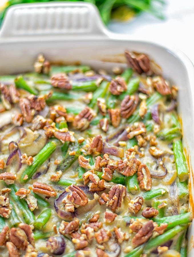 This Green Bean Casserole with Maple Pecans is insanely delicious and super easy to make with the best homemade cream of mushroom soup you can ask for. Entirely vegan, gluten free and so fantastic for dinner, lunch, meal prep, work lunch. An amazing dairy free alternative uses maple pecans instead of breadcrumbs. Perfect for holidays, Christmas. #vegan #glutenfree #dairyfree #vegetarian #dinner #lunch #mealprep #worklunchideas #contentednesscooking #holidaymeals #christmas #greenbeancasserole