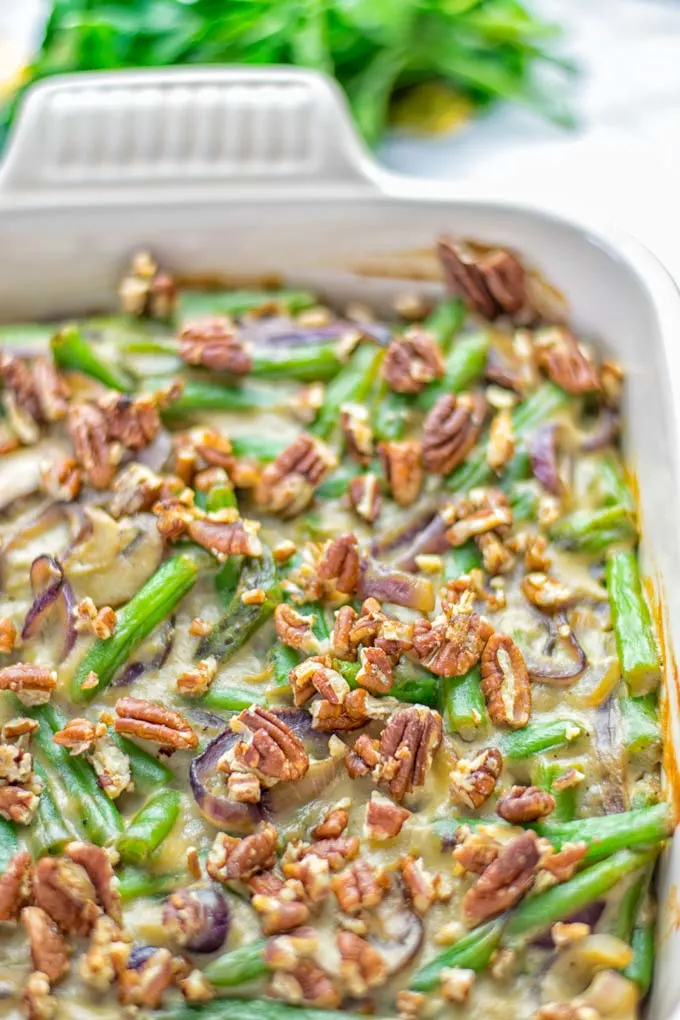 This Green Bean Casserole with Maple Pecans is insanely delicious and super easy to make with the best homemade cream of mushroom soup you can ask for. Entirely vegan, gluten free and so fantastic for dinner, lunch, meal prep, work lunch. An amazing dairy free alternative uses maple pecans instead of breadcrumbs. Perfect for holidays, Christmas. #vegan #glutenfree #dairyfree #vegetarian #dinner #lunch #mealprep #worklunchideas #contentednesscooking #holidaymeals #christmas #greenbeancasserole